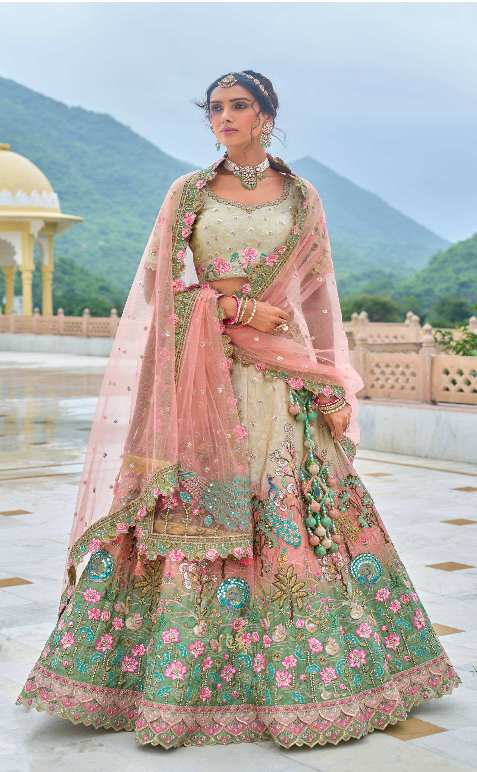 Shaded Vegan tissue lehenga with meenakari and resham work.